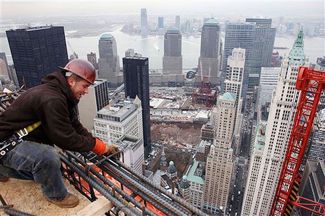 Lather Anthony Schuff ties off steel bars on the top floor of Beekman tower.
